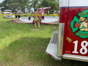 Firefighters secure the crash site of a small aircraft crash at the Leeward Air Ranch in Ocala on Wednesday morning. / Photo Credit: Marion County Fire Rescue