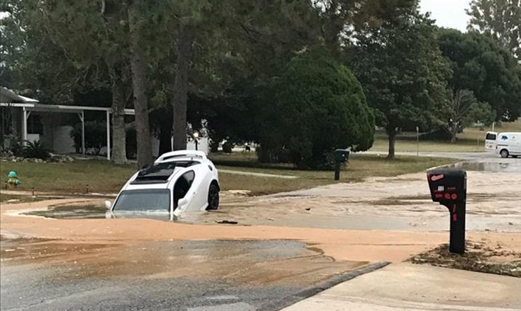 car swallowed whole by broken water main damage