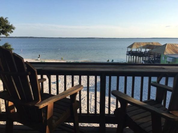 View from "Round House" balcony overlooking Gator Joe's Beach on Lake Weir. Photo Credit: Gator Joe's via Facebook.