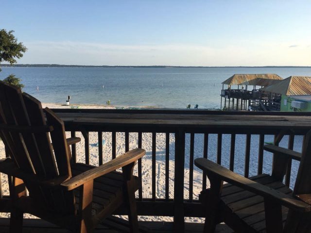 View from "Round House" balcony overlooking Gator Joe's Beach on Lake Weir. Photo Credit: Gator Joe's via Facebook.