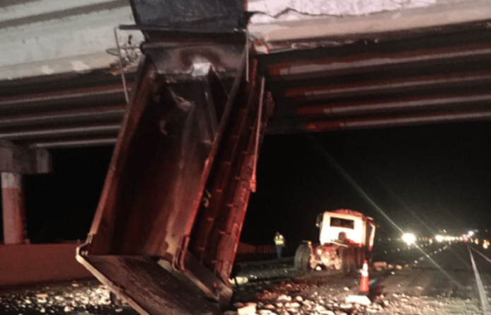 Traffic was backed up and diverted off of Interstate 75 after a dump truck collided with an overpass near Lake Panasoffkee.