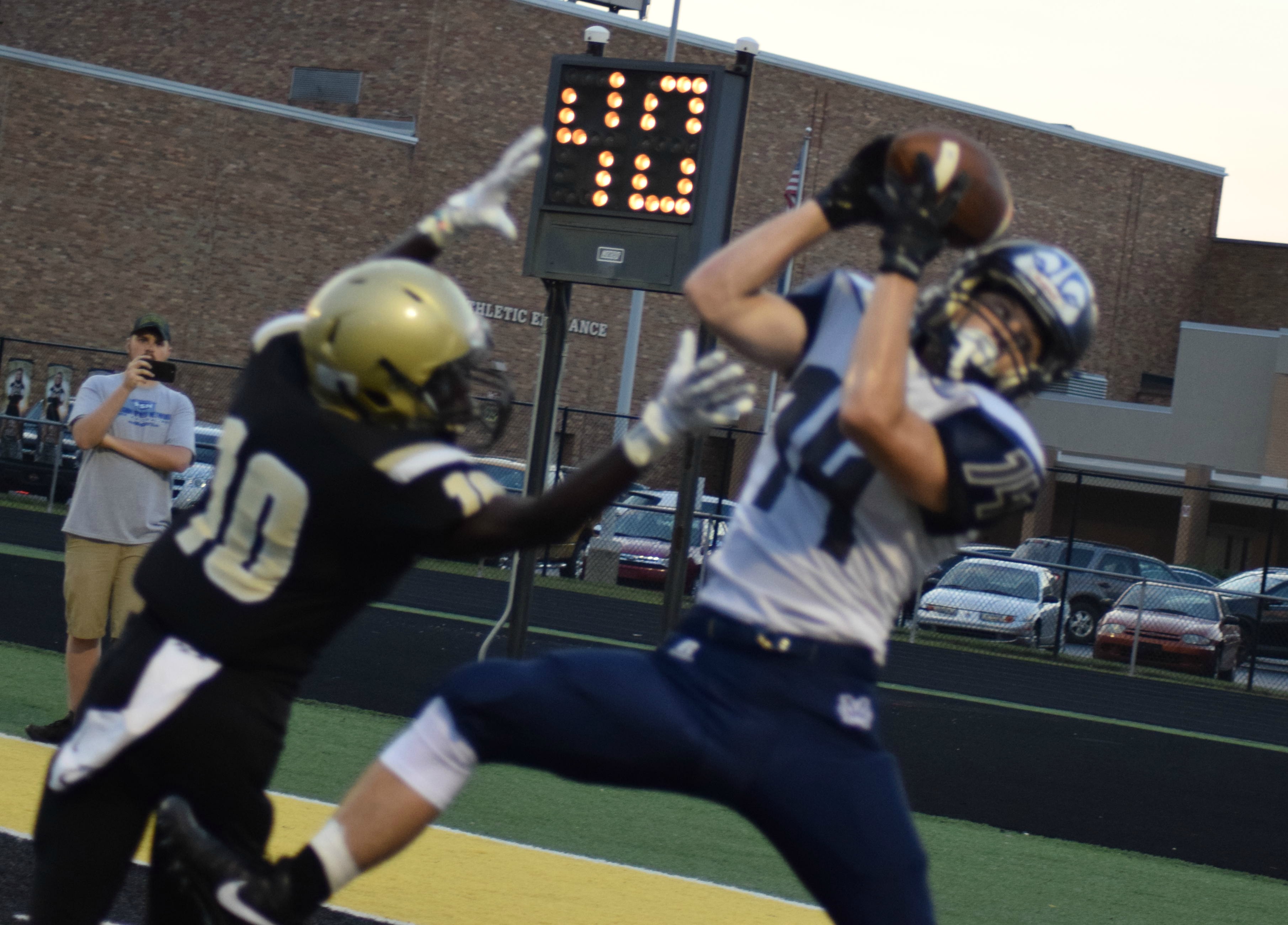 Zenon Wilhelm grabs 13 yard pass during the during the Michigan City vs. Griffith season opening game Friday night.